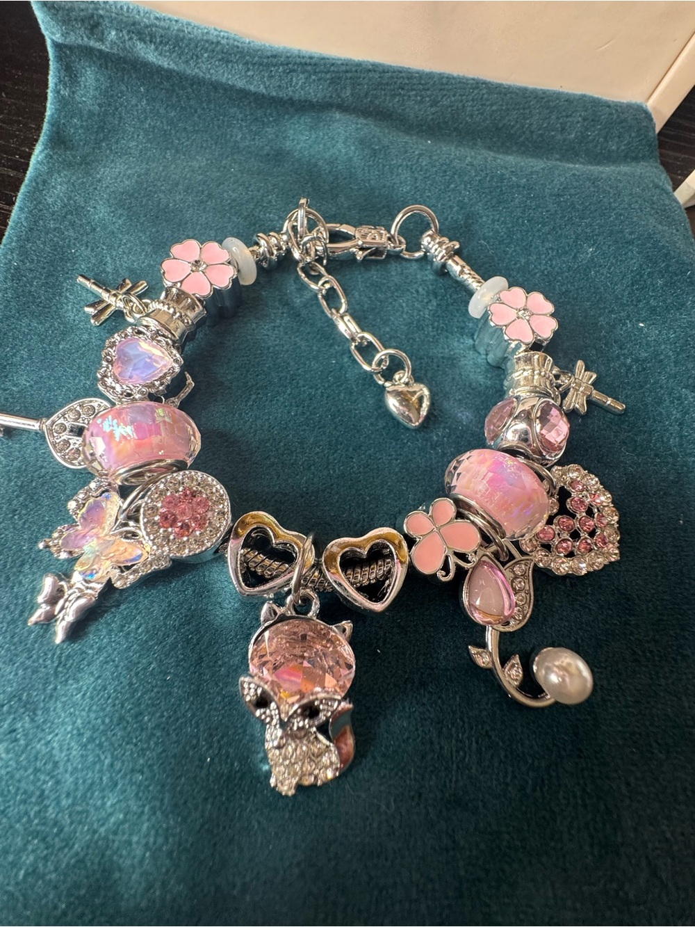 Silver-Tone Pink Charm Bracelet with Floral and Heart Accents